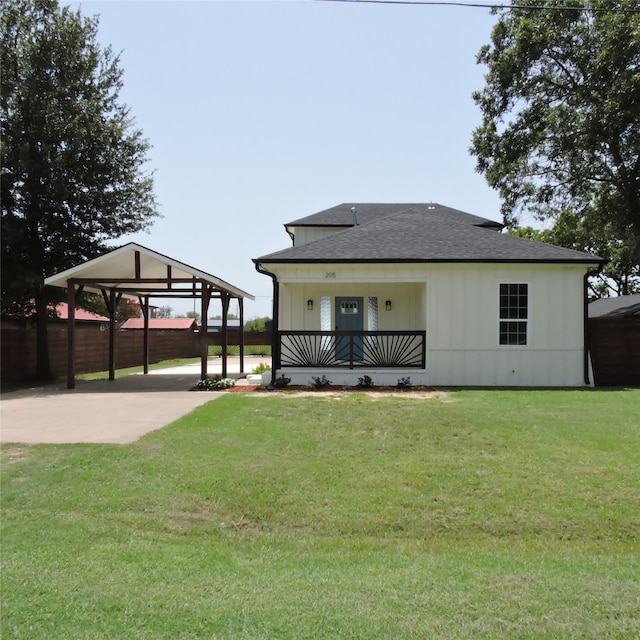 back of property with a yard and a gazebo