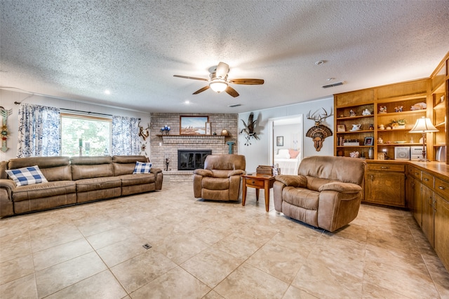 living room featuring a textured ceiling, a brick fireplace, and light tile patterned floors