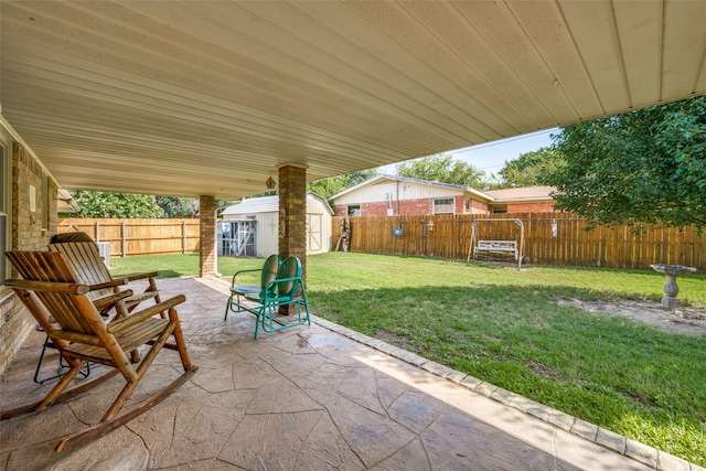 view of patio / terrace with a shed