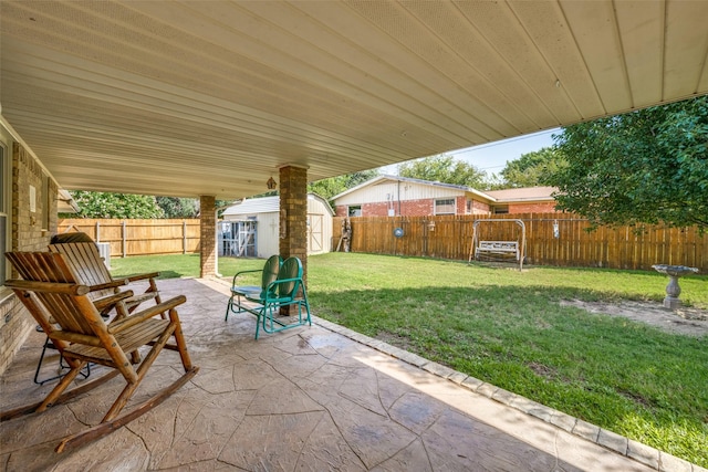 view of patio with a fenced backyard, an outdoor structure, and a shed