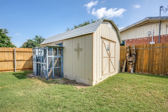 view of shed with a fenced backyard