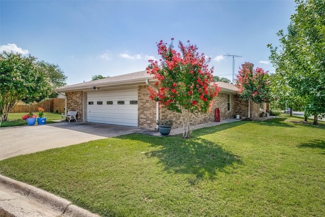 ranch-style home featuring a garage and a front yard