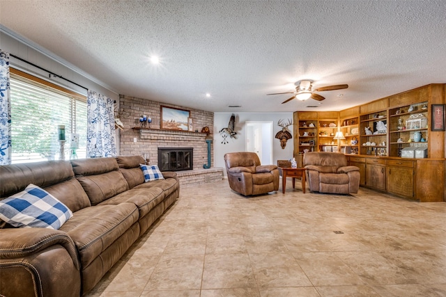 living room with a textured ceiling, ceiling fan, and a fireplace