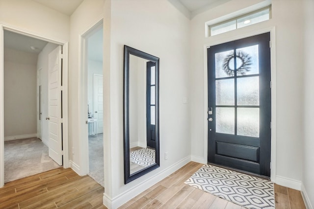 entrance foyer with light hardwood / wood-style floors