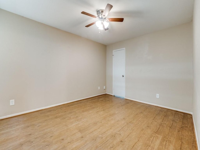 spare room featuring ceiling fan and light hardwood / wood-style floors