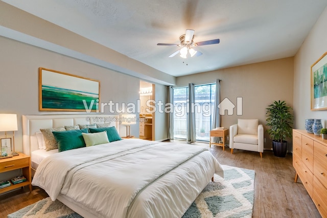 bedroom with ceiling fan and hardwood / wood-style flooring