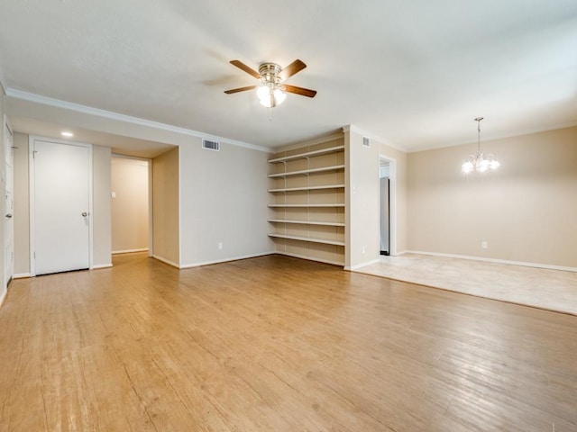 unfurnished living room with ceiling fan with notable chandelier, light hardwood / wood-style flooring, and ornamental molding