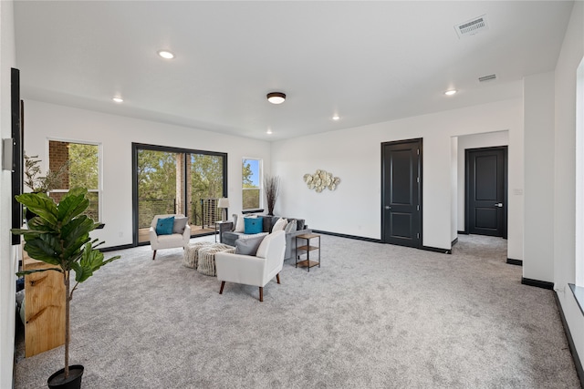 living room featuring light colored carpet