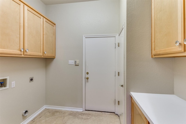 washroom featuring cabinets, hookup for an electric dryer, and hookup for a washing machine