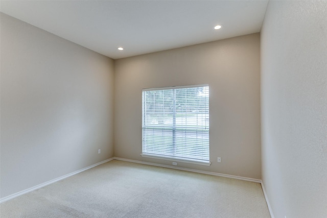 empty room featuring light colored carpet