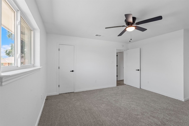 unfurnished room featuring carpet flooring and ceiling fan