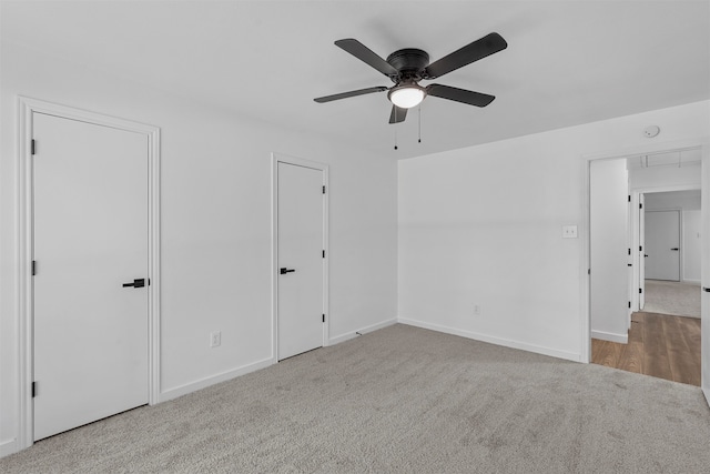 empty room with light carpet and ceiling fan