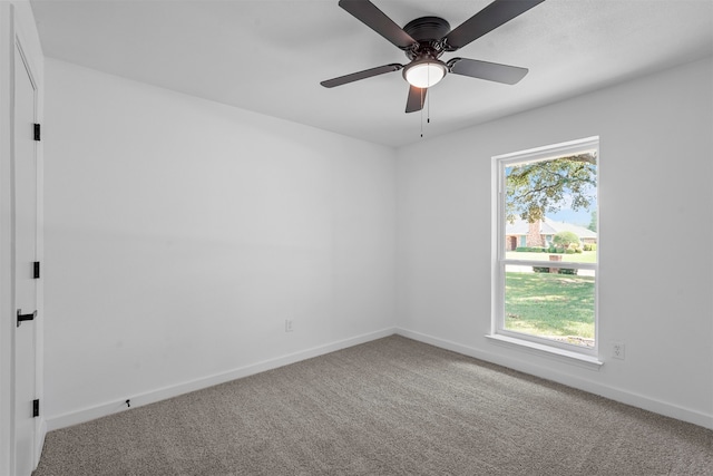 spare room featuring carpet floors and ceiling fan