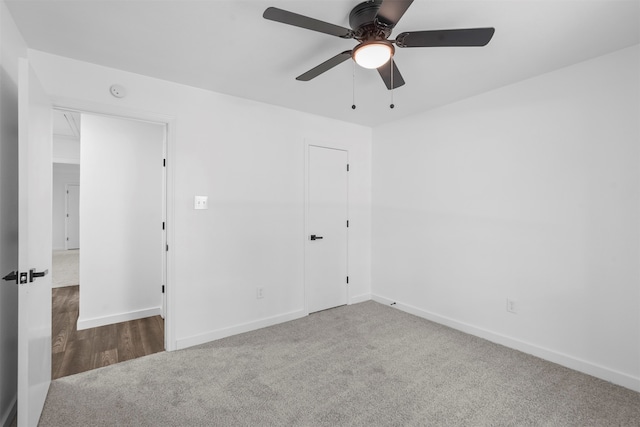 carpeted empty room with ceiling fan