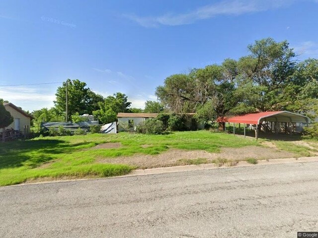 view of front of property with a carport