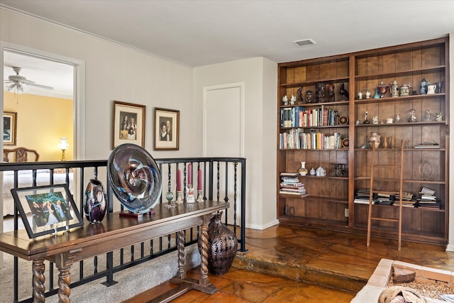 sitting room featuring ceiling fan