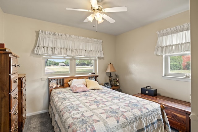 bedroom with carpet, multiple windows, and ceiling fan