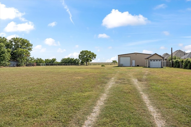 view of yard with an outdoor structure and a garage