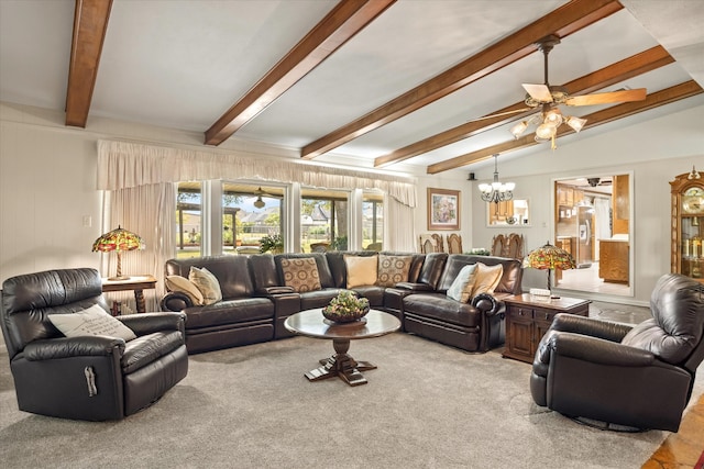 carpeted living room featuring ceiling fan with notable chandelier and lofted ceiling with beams