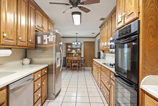 kitchen featuring decorative light fixtures, black appliances, ceiling fan, ornamental molding, and light tile patterned floors