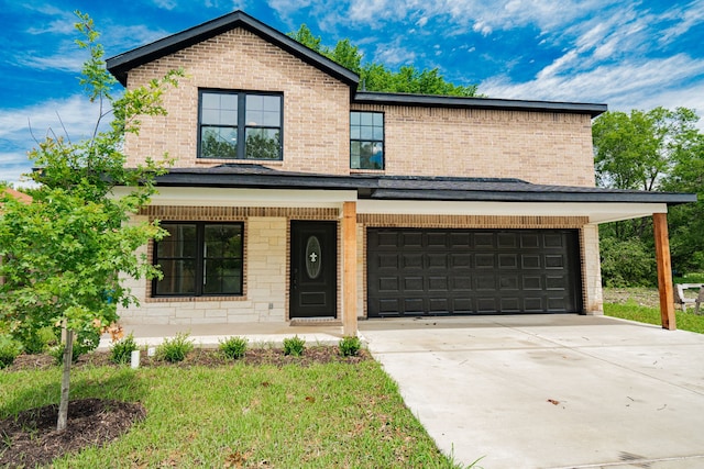 front of property with a garage