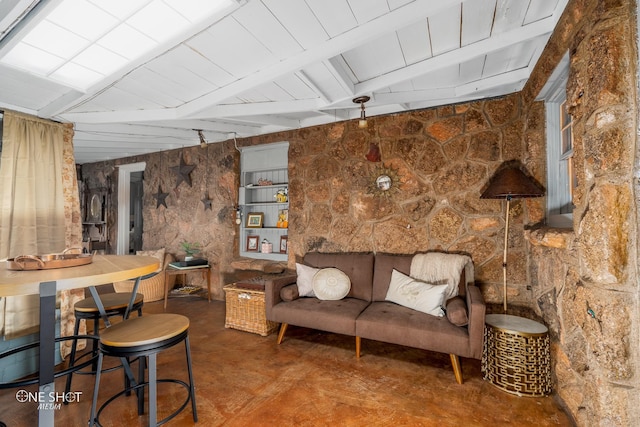 living room featuring wood ceiling and vaulted ceiling with beams