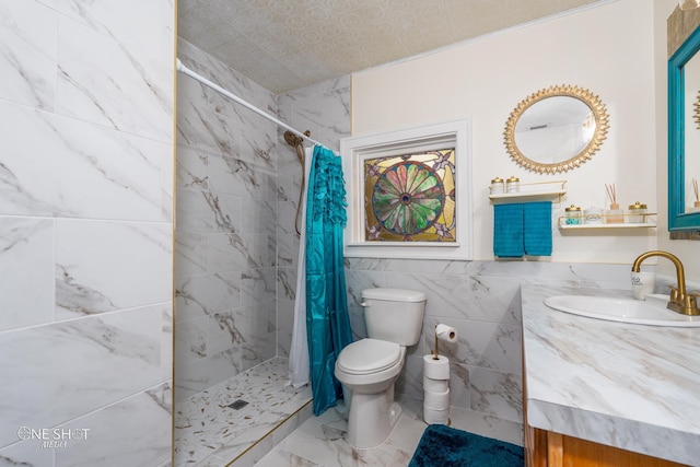 bathroom with tile walls, tile patterned flooring, toilet, vanity, and a shower with shower curtain