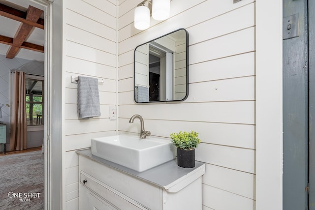 bathroom with vanity and coffered ceiling