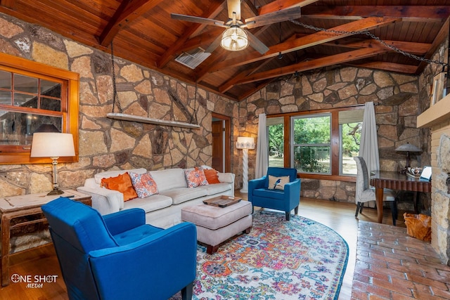 living room with hardwood / wood-style floors, wood ceiling, beam ceiling, high vaulted ceiling, and ceiling fan