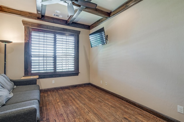 unfurnished room with beam ceiling, dark hardwood / wood-style flooring, ceiling fan, and coffered ceiling