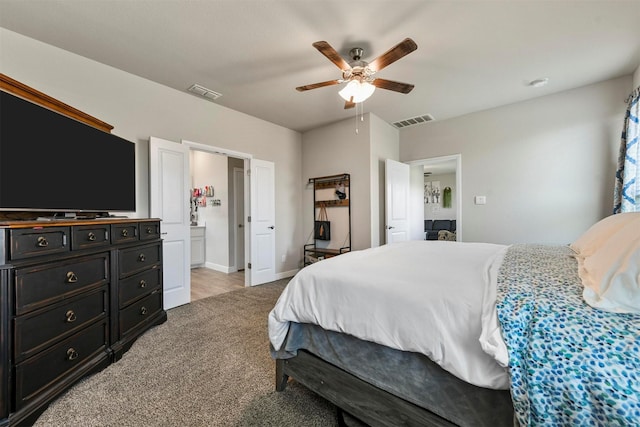 bedroom with ceiling fan and light colored carpet