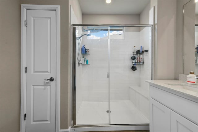 bathroom with vanity and walk in shower