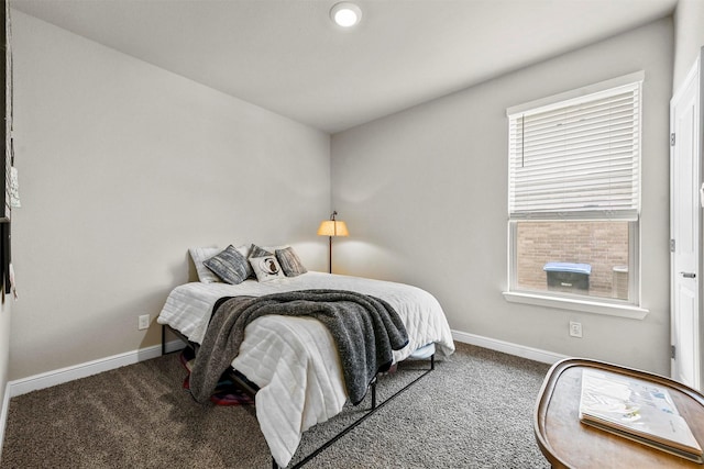 bedroom featuring carpet floors and multiple windows