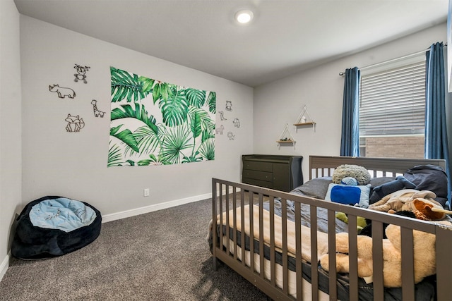 carpeted bedroom with a crib