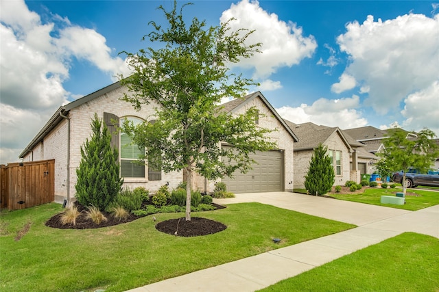 view of front of home featuring a garage and a front lawn