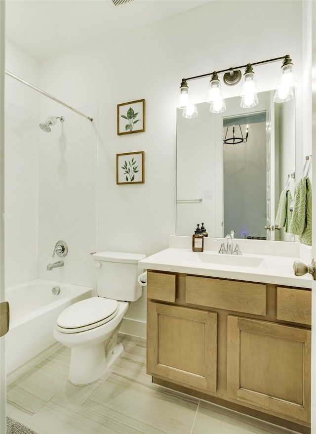 full bathroom with vanity, tile patterned flooring, tiled shower / bath, and toilet