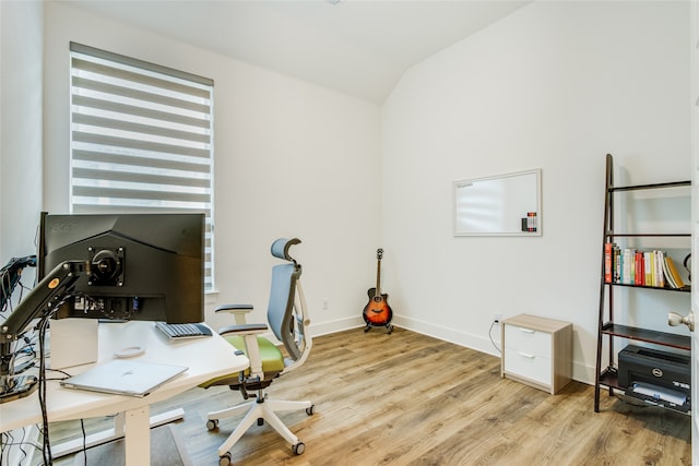 office area with lofted ceiling and light hardwood / wood-style floors