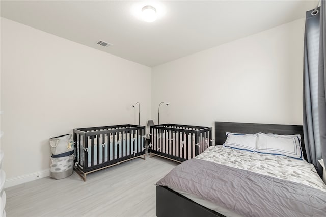 bedroom with light hardwood / wood-style flooring