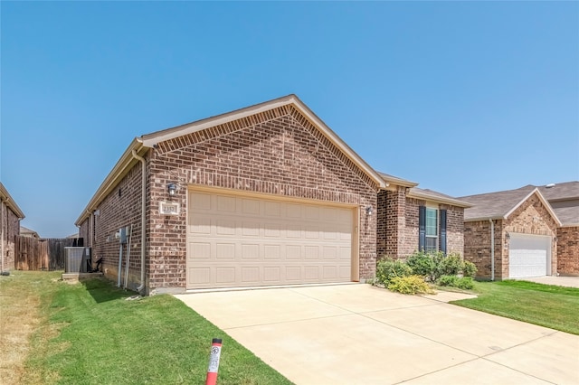 ranch-style house with a garage and a front yard