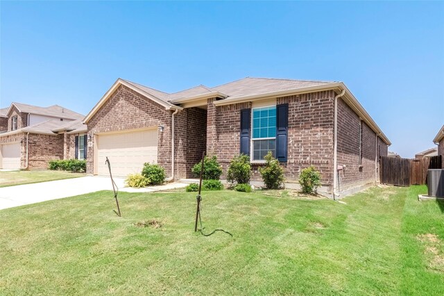 ranch-style house with a garage and a front lawn