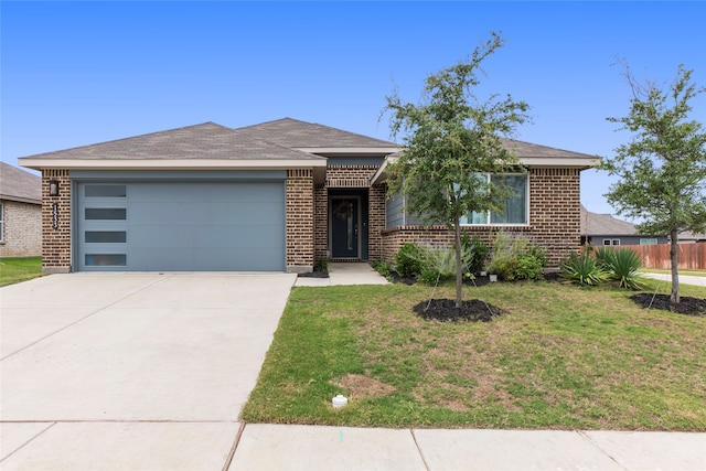 single story home with a garage and a front yard