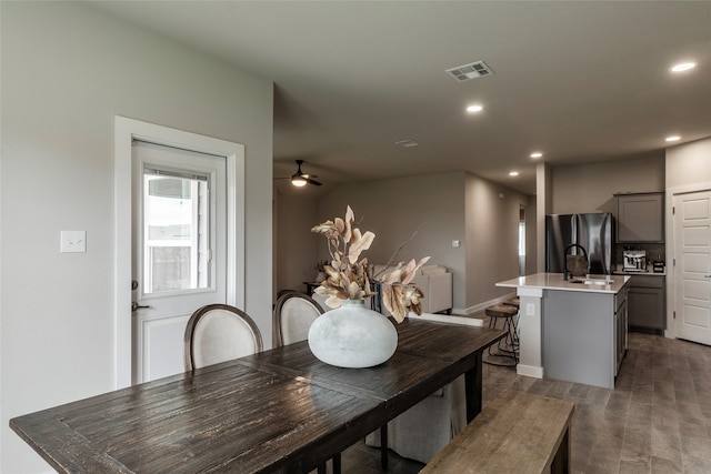 dining space with sink and ceiling fan