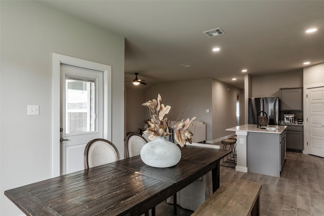 dining space with visible vents, dark wood finished floors, a ceiling fan, and recessed lighting