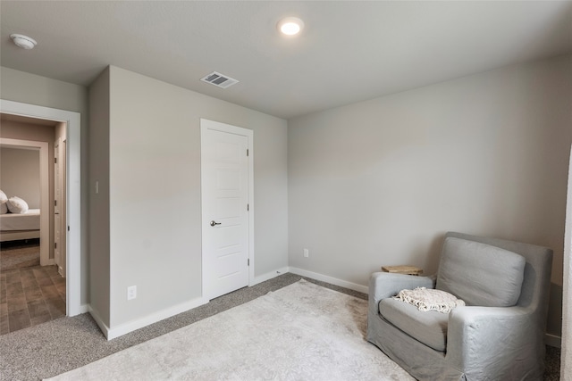 living area featuring light colored carpet