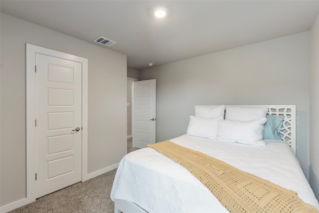 bedroom featuring light colored carpet