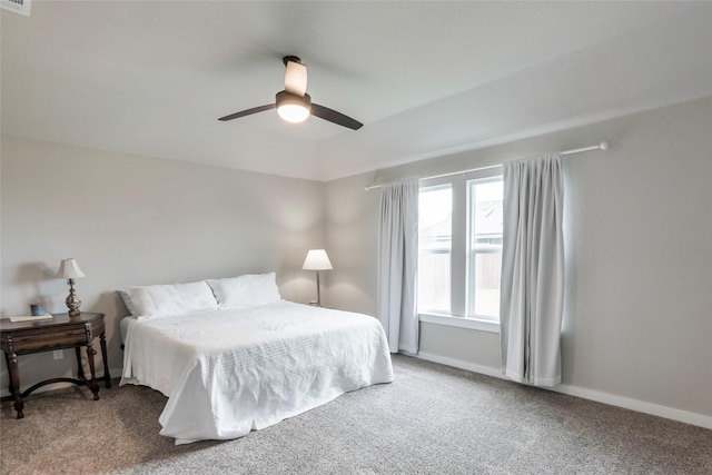 carpeted bedroom featuring ceiling fan and baseboards