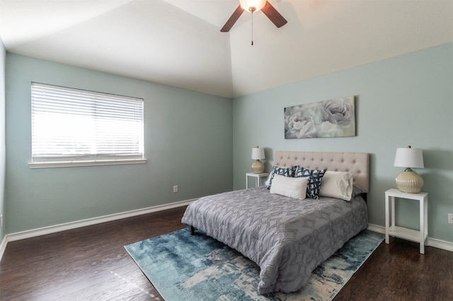 bedroom featuring ceiling fan, dark hardwood / wood-style flooring, and vaulted ceiling