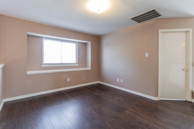 empty room featuring dark hardwood / wood-style floors