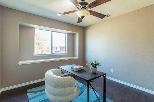 office space with dark hardwood / wood-style flooring and ceiling fan