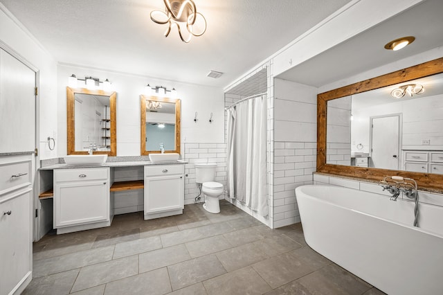 full bathroom featuring tile walls, tile patterned floors, a textured ceiling, and toilet